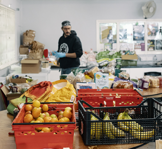 A co-op organiser packing food.